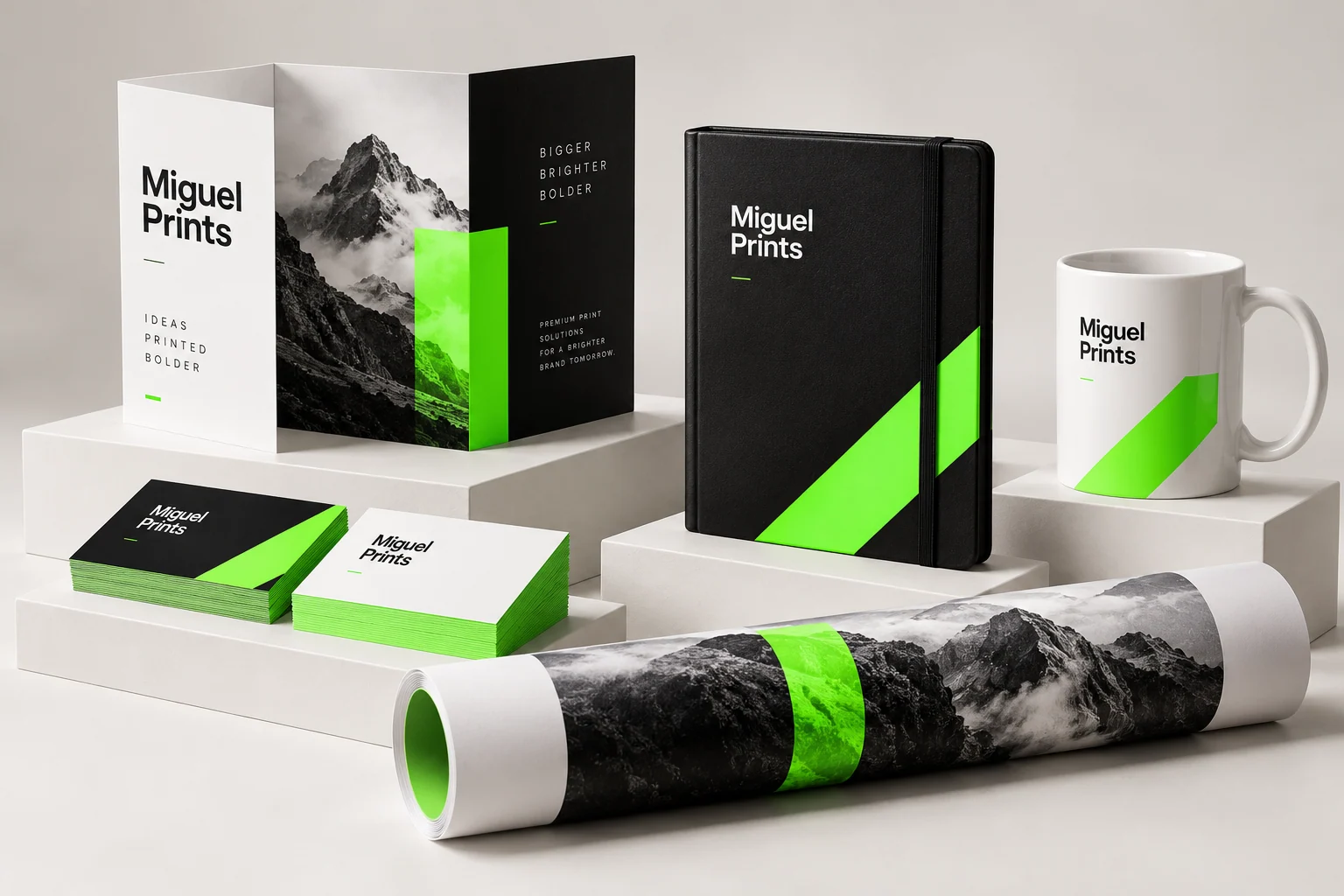 Studio concept showing coordinated business cards, brochures, a notebook and a mug